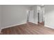 Bedroom with wood-look floors showcasing multiple access doors at 236 Katie Dr, Rocky Mount, NC 27803