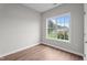 Bedroom features a window with a view and wood-look flooring at 236 Katie Dr, Rocky Mount, NC 27803