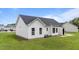 Rear exterior shot showcasing the home's siding, roof, and well-kept lawn at 236 Katie Dr, Rocky Mount, NC 27803
