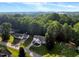 Charming single-story home surrounded by lush greenery and trees at 240 Carrington Ave, Franklinton, NC 27525