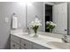 Bathroom vanity features dual sinks, ample storage, and lovely floral arrangements at 240 Carrington Ave, Franklinton, NC 27525