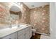 Charming bathroom with white vanity, a round mirror, and stylish floral wallpaper at 240 Carrington Ave, Franklinton, NC 27525