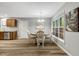 Cozy dining area with a round table, stylish chairs, and a view of the backyard at 240 Carrington Ave, Franklinton, NC 27525
