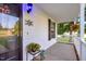 Inviting covered front porch featuring stylish decor and a glimpse of the home's address at 240 Carrington Ave, Franklinton, NC 27525