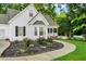 Well-maintained one-story home with a beautifully landscaped front yard and inviting walkway at 240 Carrington Ave, Franklinton, NC 27525