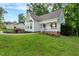 Landscaped front yard, covered front porch, and attached garage at 240 Carrington Ave, Franklinton, NC 27525