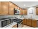 Updated kitchen with granite countertops, stainless steel appliances, and modern lighting at 240 Carrington Ave, Franklinton, NC 27525