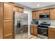 Modern kitchen with stainless steel appliances, light countertops, and abundant cabinet space at 240 Carrington Ave, Franklinton, NC 27525