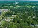 Aerial view of a neighborhood with mature trees and landscaping at 2504 W Club Blvd, Durham, NC 27705