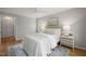 Serene bedroom with ceiling fan, featuring a comfortable bed and matching nightstands for a relaxing retreat at 2504 W Club Blvd, Durham, NC 27705