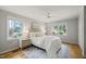 Cozy bedroom with bright natural light, ceiling fan, and comfortable furnishings, perfect for relaxation at 2504 W Club Blvd, Durham, NC 27705