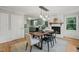 Open dining area connecting to the kitchen with a cozy fireplace feature at 2504 W Club Blvd, Durham, NC 27705
