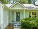 Inviting front entrance with a covered porch and well-maintained yard at 2504 W Club Blvd, Durham, NC 27705