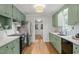 Spacious kitchen with modern appliances and a connecting view to the outdoors at 2504 W Club Blvd, Durham, NC 27705