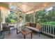 Relaxing screened-in porch with comfortable seating, outdoor decor, and a view of the backyard at 2504 W Club Blvd, Durham, NC 27705