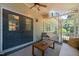 Inviting screened porch featuring a cozy seating area and ambient string lights at 2504 W Club Blvd, Durham, NC 27705
