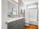Clean bathroom with a single vanity, bathtub, and wood floors at 262 Salt Cedar Ln, Chapel Hill, NC 27516