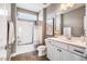 Well-lit bathroom with a shower/tub combo, white vanity and neutral gray walls, perfect for relaxation at 262 Salt Cedar Ln, Chapel Hill, NC 27516