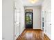 Elegant entryway with hardwood floors and doors, creating a bright and welcoming space at 262 Salt Cedar Ln, Chapel Hill, NC 27516
