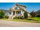 Charming two-story home featuring a welcoming front porch and beautifully landscaped front yard at 262 Salt Cedar Ln, Chapel Hill, NC 27516