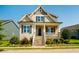 Charming home featuring a welcoming front porch with stone accents and manicured landscaping at 262 Salt Cedar Ln, Chapel Hill, NC 27516