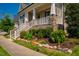 A beautifully landscaped front yard with stone accents leads to the welcoming porch at 262 Salt Cedar Ln, Chapel Hill, NC 27516