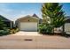 Attached garage with white door and concrete driveway, offering convenient parking and storage space at 262 Salt Cedar Ln, Chapel Hill, NC 27516