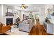 Open-concept living room flows into the kitchen, with hardwood floors and modern décor at 262 Salt Cedar Ln, Chapel Hill, NC 27516