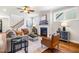Stylish living room features a fireplace, hardwood floors, and comfortable seating at 262 Salt Cedar Ln, Chapel Hill, NC 27516