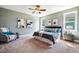 Serene primary bedroom with a large bed, accent chair, and plenty of natural light at 262 Salt Cedar Ln, Chapel Hill, NC 27516