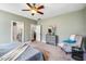 Partial view of primary bedroom with bed, bath, and adjacent sitting room at 262 Salt Cedar Ln, Chapel Hill, NC 27516