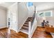 Open staircase features hardwood floors, carpeted stairs, and modern railings at 262 Salt Cedar Ln, Chapel Hill, NC 27516