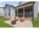 Backyard featuring a screened porch, patio with firepit, and fenced yard at 2806 High Plains Dr, Fuquay Varina, NC 27526