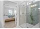 Modern bathroom featuring herringbone tile in the shower and ensuite access to the bedroom at 2806 High Plains Dr, Fuquay Varina, NC 27526