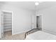 Neutral bedroom featuring carpeted floors, closet with shelves, ceiling fan, and doorway to another room at 2806 High Plains Dr, Fuquay Varina, NC 27526