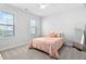 Bedroom with carpet, natural light, ceiling fan, decorative pillows, and a full length mirror at 2806 High Plains Dr, Fuquay Varina, NC 27526