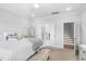 Well-lit bedroom with modern furnishings and ensuite access to the bathroom and stairs at 2806 High Plains Dr, Fuquay Varina, NC 27526