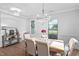 Bright dining area with natural light, stylish furnishings, and view into the kitchen at 2806 High Plains Dr, Fuquay Varina, NC 27526