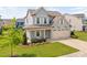 Inviting two-story home boasting a two-car garage, cozy front porch, and a beautifully landscaped yard at 2806 High Plains Dr, Fuquay Varina, NC 27526