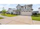 Charming two-story home with a two-car garage, manicured lawn, and inviting curb appeal on a sunny day at 2806 High Plains Dr, Fuquay Varina, NC 27526