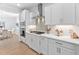 Well-equipped kitchen featuring white cabinetry, modern appliances, and seamless access to dining area at 2806 High Plains Dr, Fuquay Varina, NC 27526