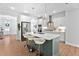 Bright, modern kitchen with stainless steel appliances, quartz countertops, and island seating at 2806 High Plains Dr, Fuquay Varina, NC 27526
