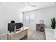 Office space with carpet, natural light, a ceiling fan, and a light wood desk and modern white sofa at 2806 High Plains Dr, Fuquay Varina, NC 27526