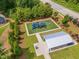 Well-maintained community playground with blue and black play structure, picnic shelter and lush green grass at 2806 High Plains Dr, Fuquay Varina, NC 27526