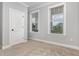 Cozy bedroom with carpet floors, a closet, two windows that provide natural light at 2914 Farmhouse Dr, Apex, NC 27502