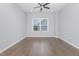 Spacious bedroom featuring hardwood floors, a ceiling fan and lots of natural light at 2914 Farmhouse Dr, Apex, NC 27502