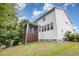 Exterior angle view of the back of the home with screened in porch at 2914 Farmhouse Dr, Apex, NC 27502