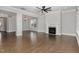 Sunlit living room boasts hardwood floors, a fireplace, and ample natural light at 2914 Farmhouse Dr, Apex, NC 27502