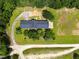 Stunning aerial view of the home showcasing the vast property, circular driveway and serene setting at 3129 Tarheel Clubhouse Road Rd, Raleigh, NC 27604