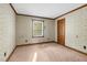 Neutral bedroom with carpet, wallpaper and natural light from window at 3129 Tarheel Clubhouse Road Rd, Raleigh, NC 27604